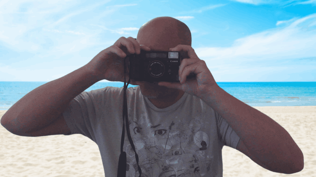 Picture of me with a camera uploading content to microstock