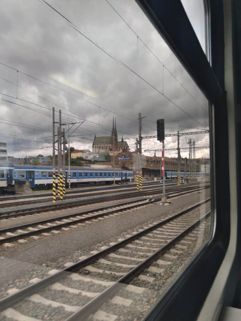 Random picture of a church on a hill with train tracks when traveling I took.