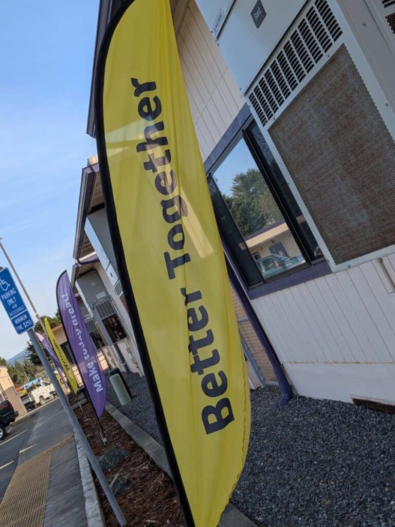 An outdoor flag that says "Better Together." A non profit where someone can get a remote job for.