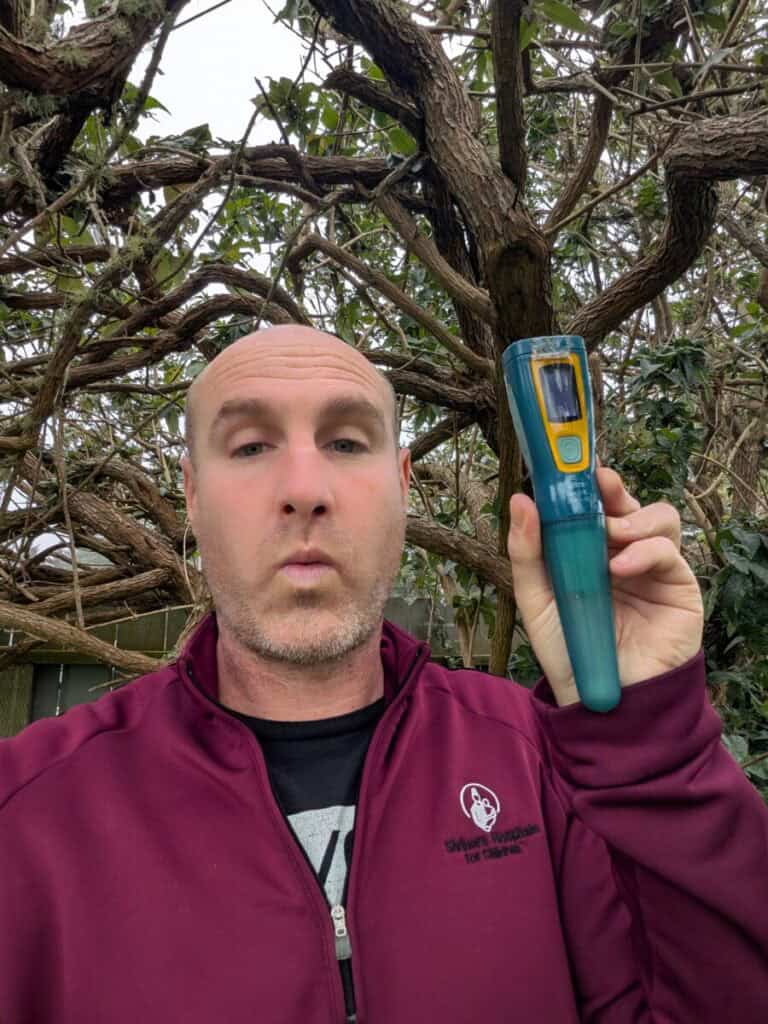 A picture of me holding up a Steripen. Some people want to know 12 benefits of Steripen for Solo Female Travelers!