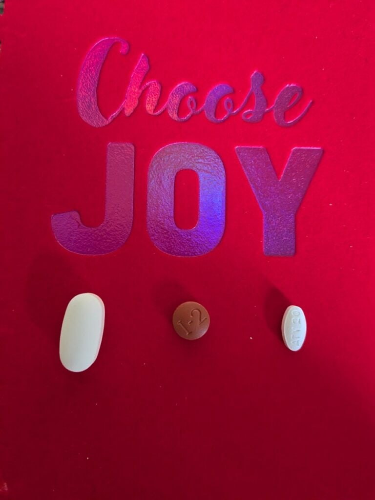 A picture saying "choose joy" with 3 different pills. Some wonder about the best water tablets for international travel.