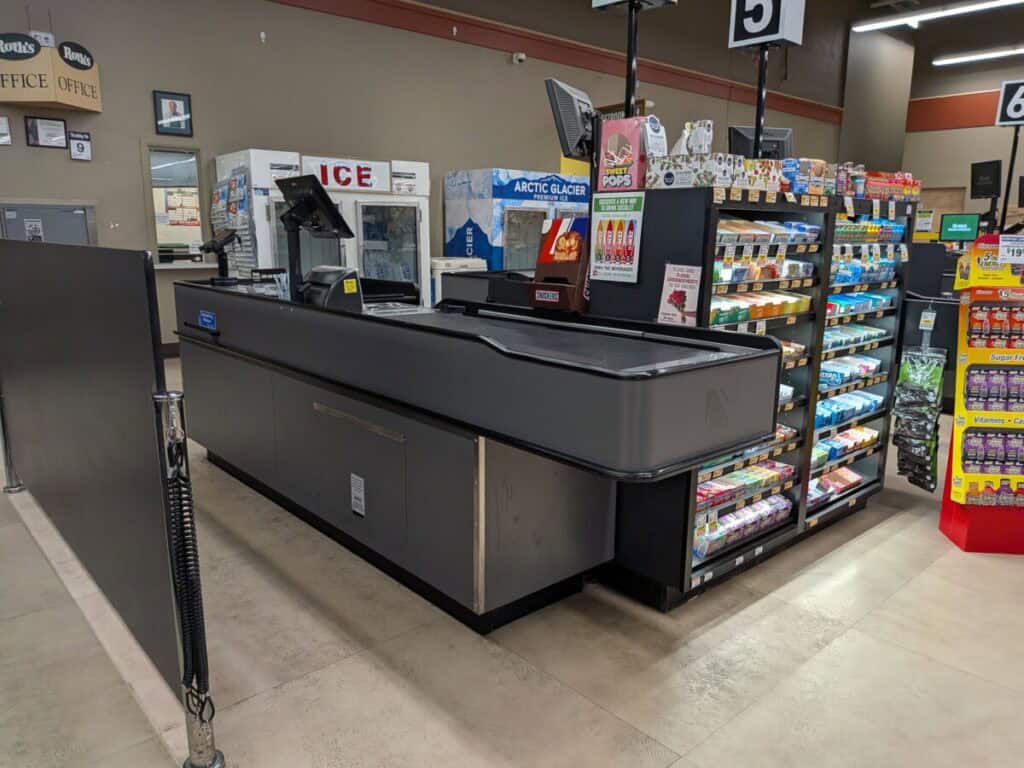 A picture of a grocery checkout table. Some wonder about the top 5 receipt scanning apps that pay for any receipt.